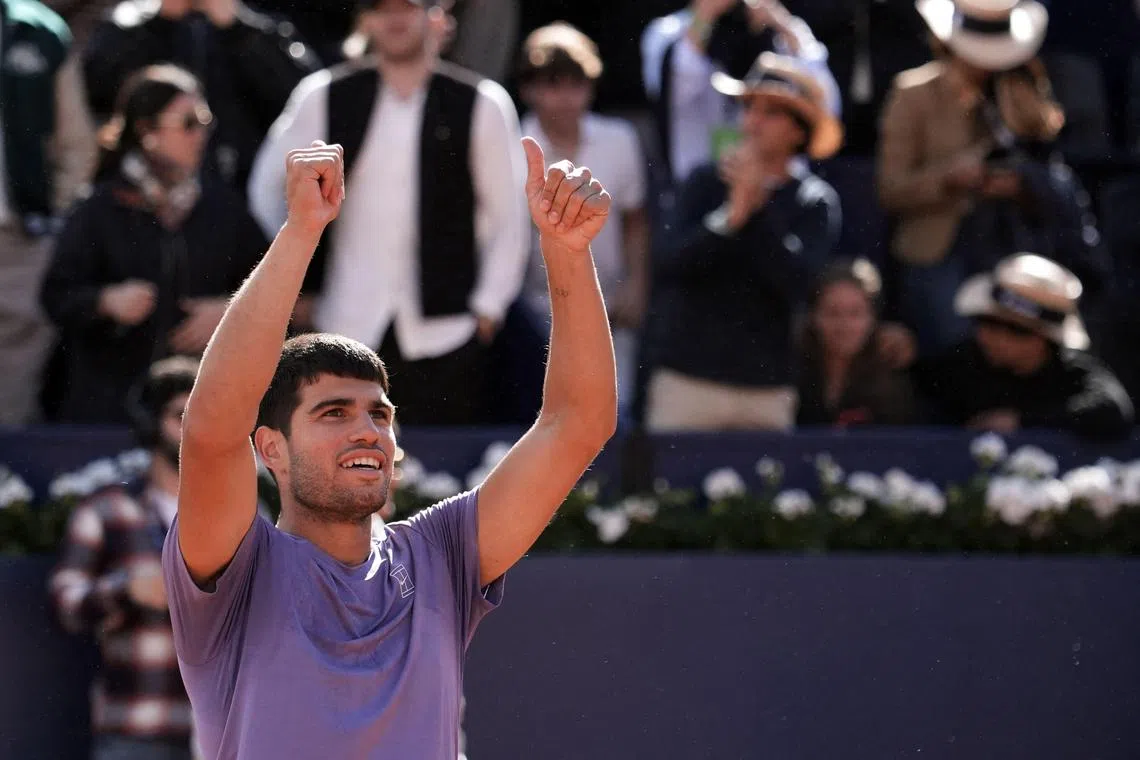 Spain's Carlos Alcaraz celebrates beating France's Arthur Fils to reach the Barcelona Open final.