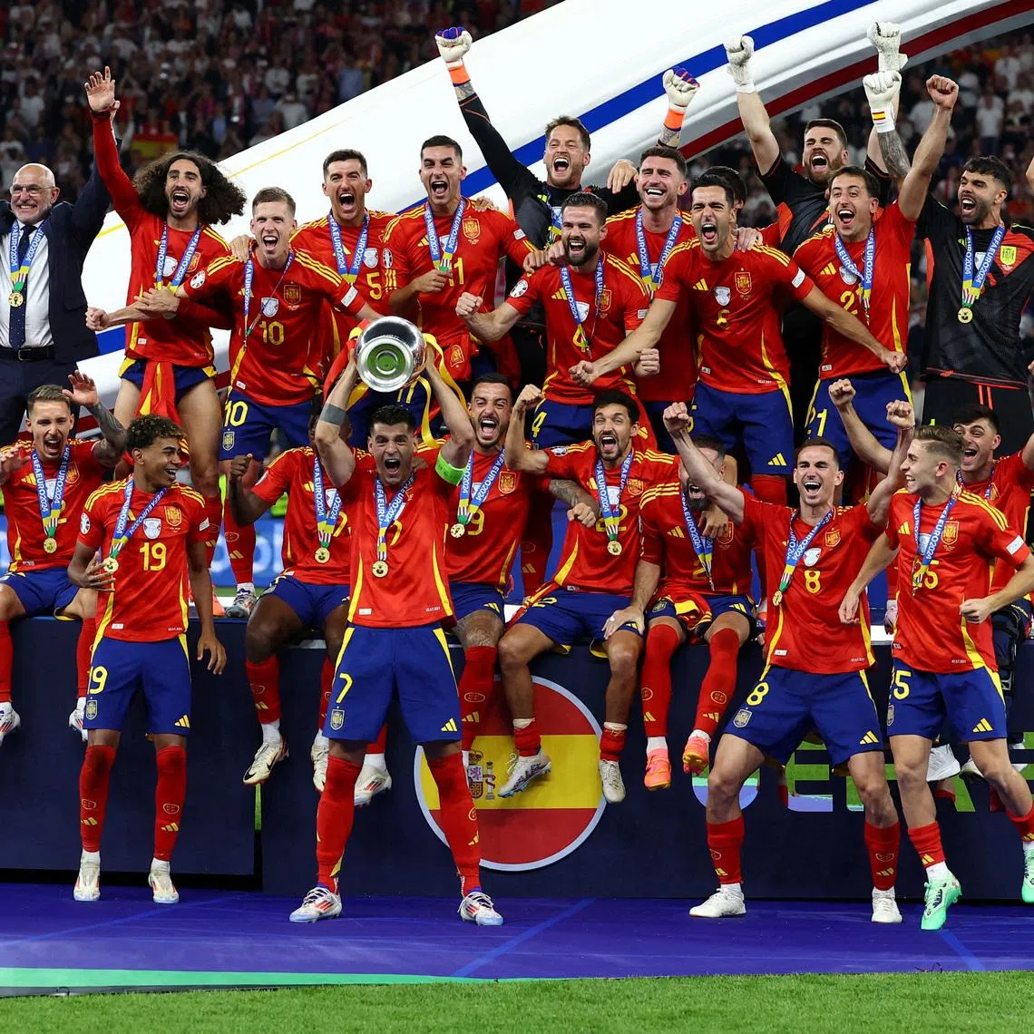 FILE PHOTO: Soccer Football - Euro 2024 - Final - Spain v England - Berlin Olympiastadion, Berlin, Germany - July 14, 2024 Spain's Alvaro Morata lifts the trophy as they celebrate winning the Euro 2024 REUTERS/Lee Smith/File Photo