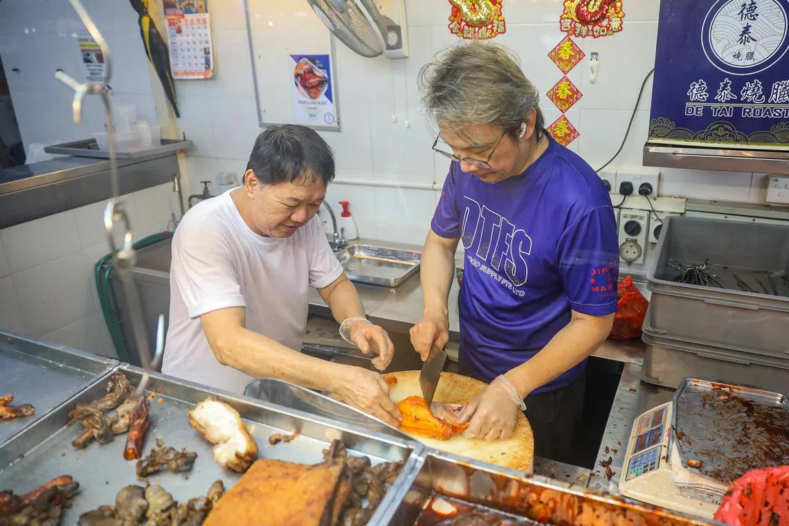 ST20241002_202443400474/jomeat/Luther Lau/John Lui SO/
Story Background:
gig economy series - learning how to cut meat at de tai roast meat stall. Shots of John Lui (Journalist/Right) learning the technique from Ray Leong (Owner of De Tai Roast/Left) on cutting roast duck. Taken at De Tai at Kovan market.