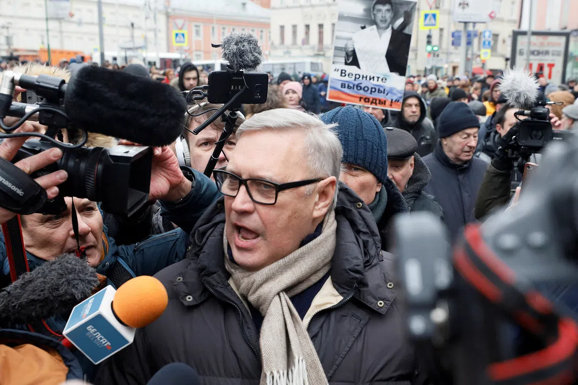 FILE PHOTO: Russian opposition figure Mikhail Kasyanov talks to the media during a rally to mark the 5th anniversary of opposition politician Boris Nemtsov's murder and to protest against proposed amendments to the country's constitution, in Moscow, Russia February 29, 2020. REUTERS/Shamil Zhumatov/File Photo