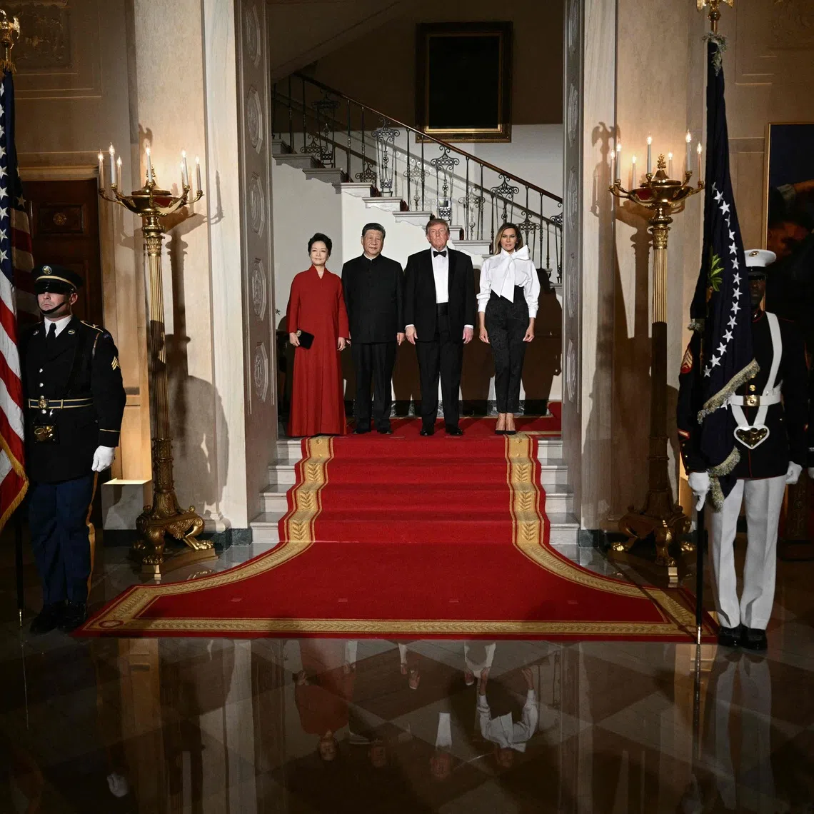 US President Donald Trump and First Lady Melania Trump posing for photos with Chinese President Xi Jinping and his wife Peng Liyuan before a state dinner at the White House on Sept 24.