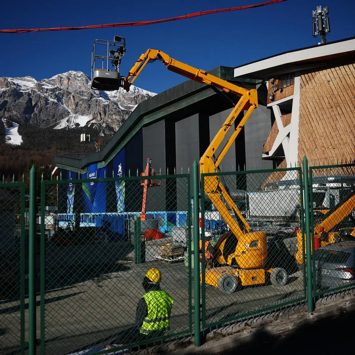 Milano Cortina 2026 Winter Olympics - Previews - Cortina d'Ampezzo, Italy - January 21, 2026 General view outside the Cortina Curling Olympic Stadium as workers prepare ahead of the Milano Cortina 2026 Winter Olympics REUTERS/Guglielmo Mangiapane