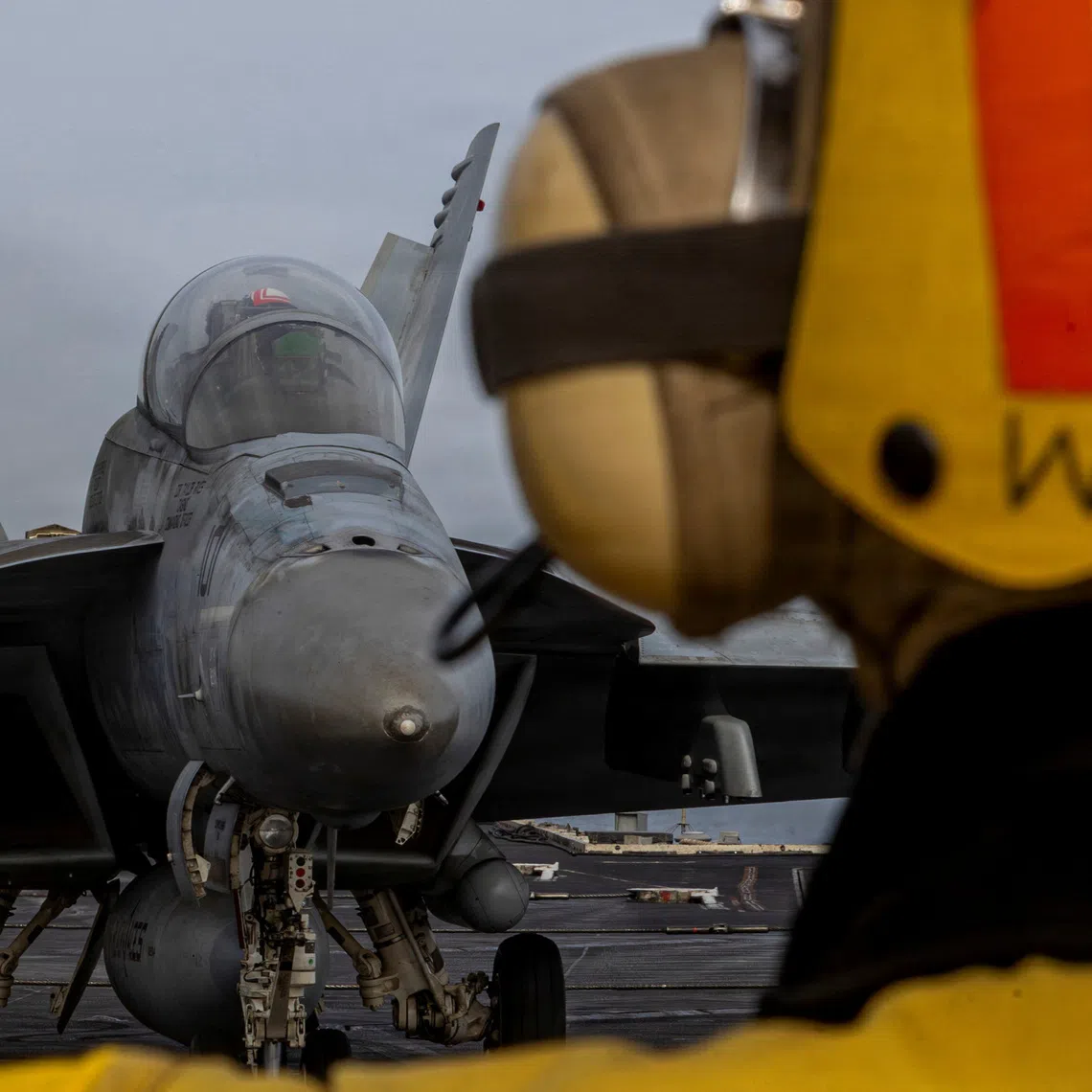 An F/A-18F Super Hornet preparing to launch from the flight deck of the US Navy Nimitz-class aircraft carrier USS Abraham Lincoln on March 31.