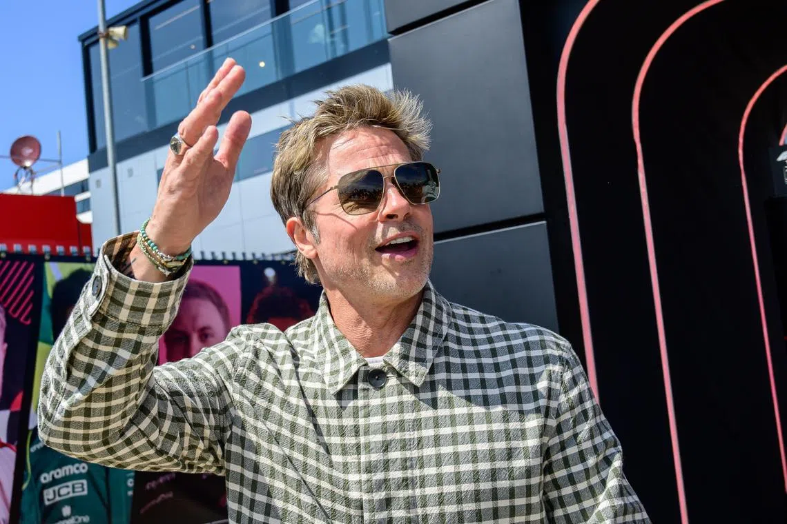 US actor Brad Pitt, playing Sonny Hayes of the fictional Apex team for an F1-inspired movie, arrives for the Formula 1 British Grand Prix 2023, at the Silverstone Circuit race track in Silverstone, Britain, July 9, 2023.  