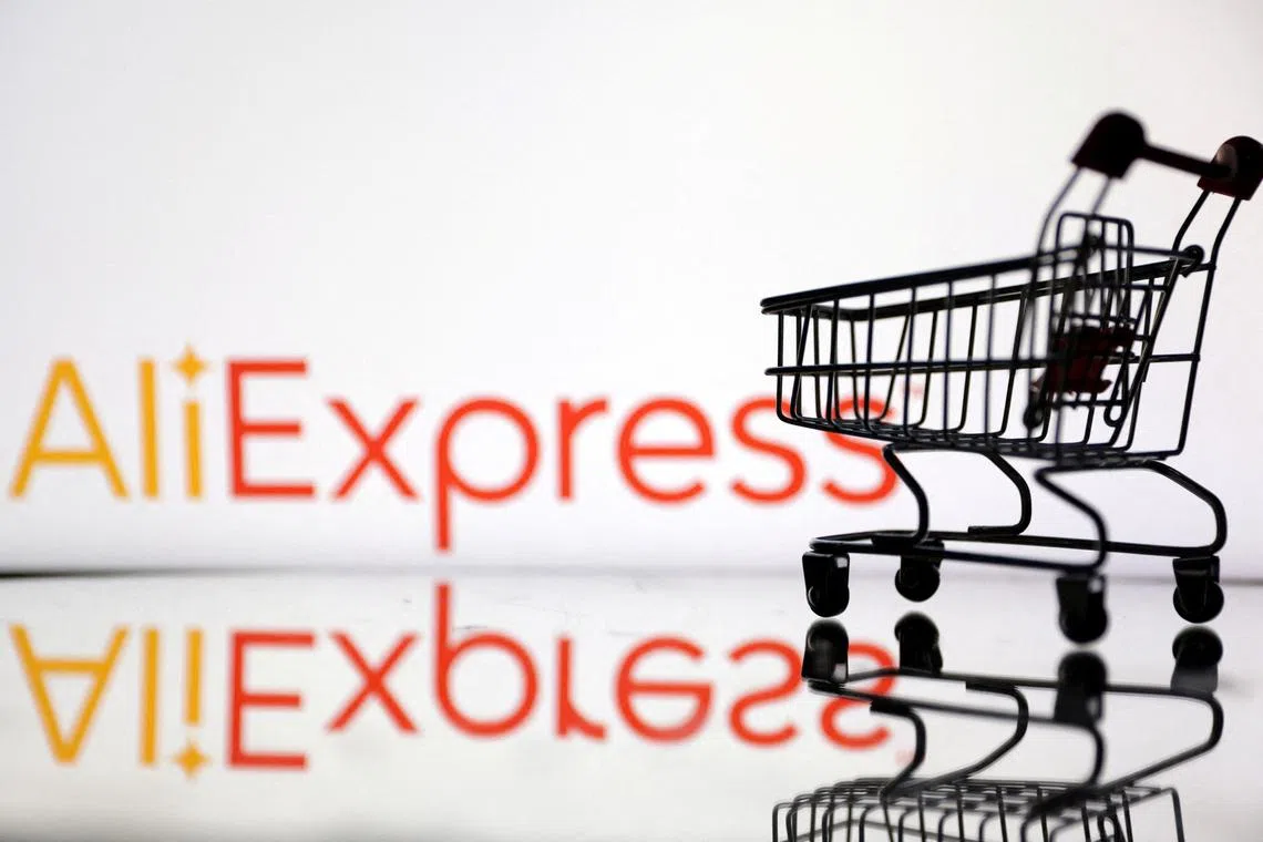 FILE PHOTO: Shopping trolley is seen in front of AliExpress logo in this illustration, July 24, 2022. REUTERS/Dado Ruvic/File Photo