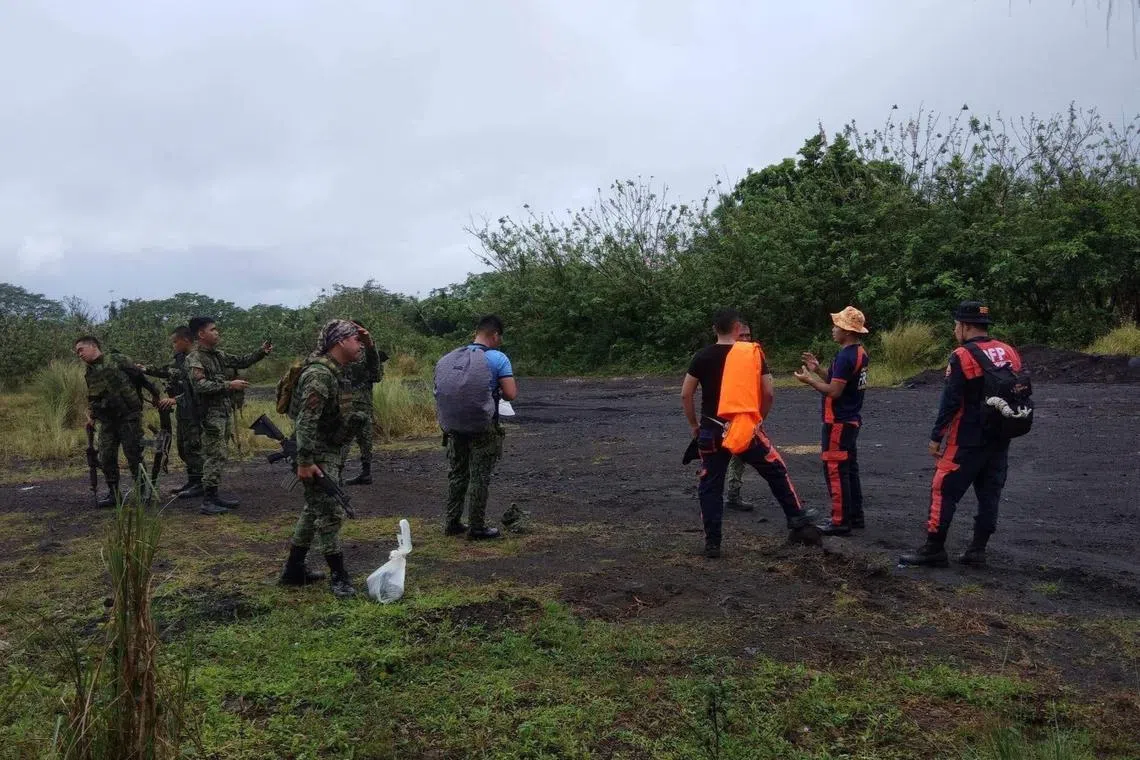 Firemen and soldiers on their way to their search for the crashed plane.