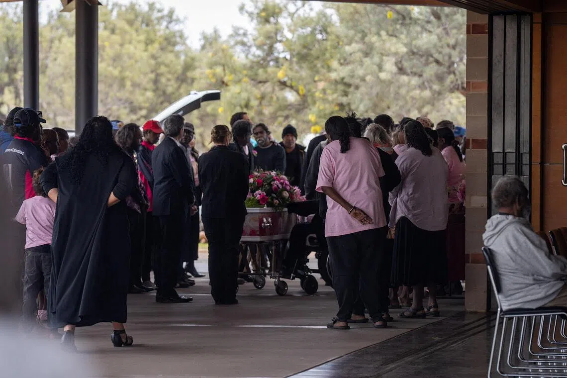 Mourners attend the funeral service for five-year-old Kumanjayi Little Baby at Alice Springs Garden Cemetery in Australia on Aug 15.