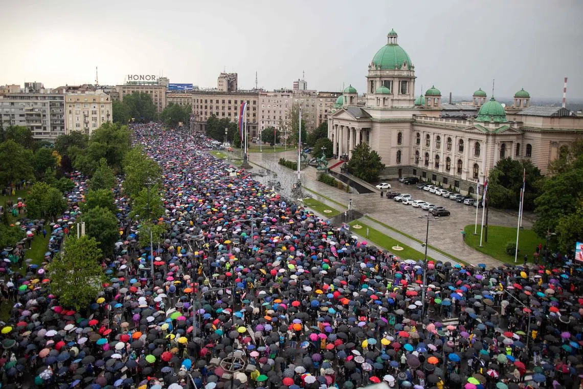 Demonstrators defied heavy rain to demand to ring the building of the state-run RTS broadcaster, demanding the resignations of top directors and editors.