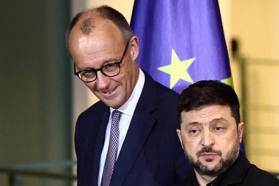 FILE PHOTO: Ukrainian President Volodymyr Zelenskiy and German Chancellor Friedrich Merz attend a press conference at the Chancellery in Berlin, Germany December 15, 2025. REUTERS/Liesa Johannssen/File Photo