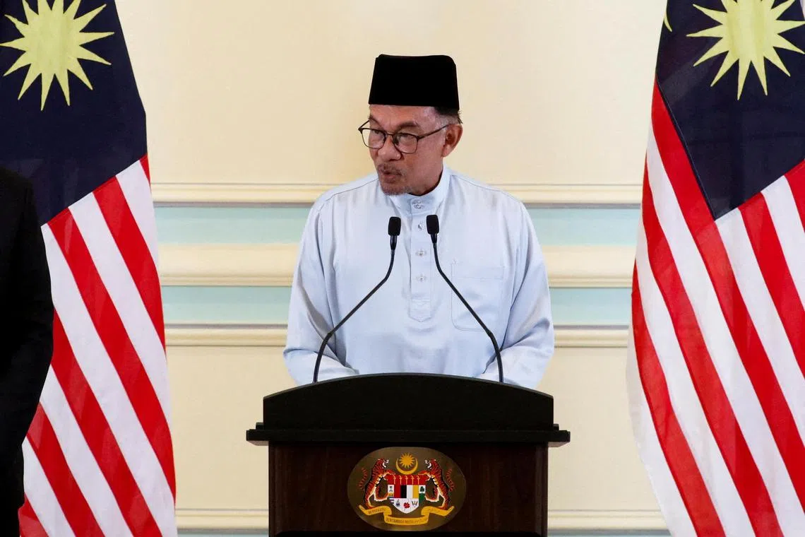 Malaysian Prime Minister Anwar Ibrahim speaks during a news conference at Putrajaya on Dec 2, 2022.