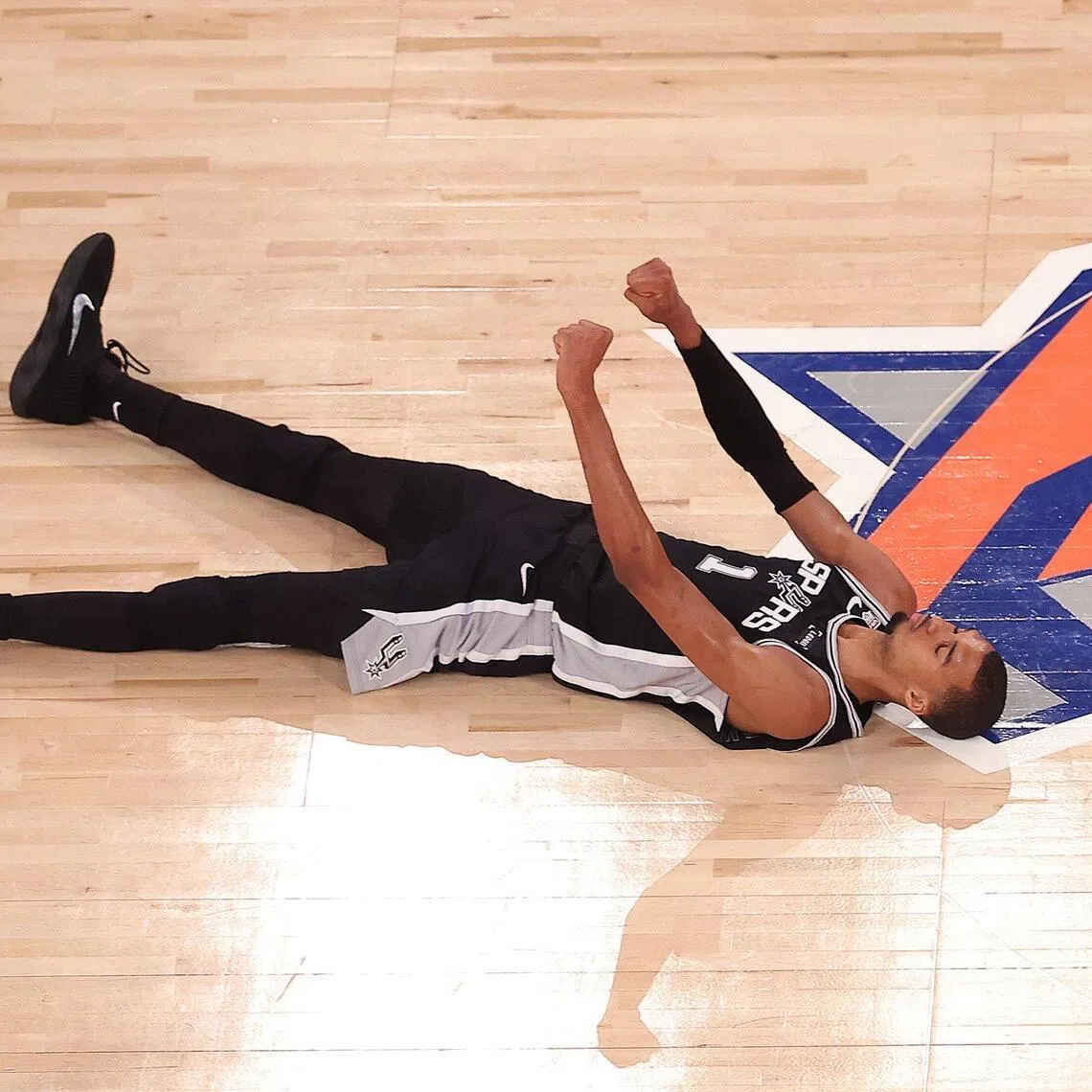 Victor Wembanyama of the San Antonio Spurs reacts after shooting a three point basket and being fouled during the fourth quarter against the New York Knicks on June 8.