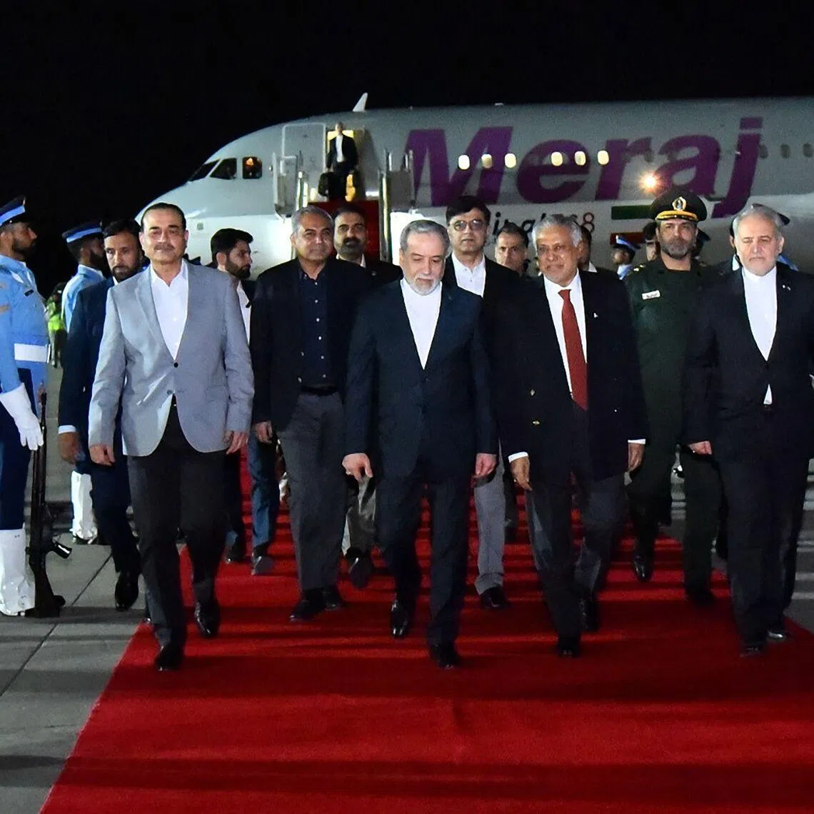 Iran's Foreign Minister Abbas Araqchi (centre) arrives at Nur Khan air base in Rawalpindi, near Islamabad on April 24.