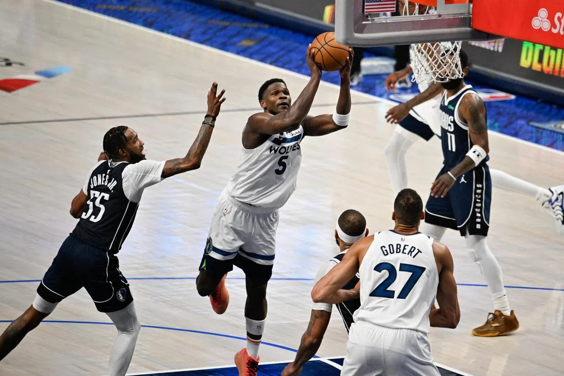 Minnesota Timberwolves guard Anthony Edwards shoots against the Dallas Mavericks during the fourth quarter of Game 4 of the NBA Western Conference Finals.