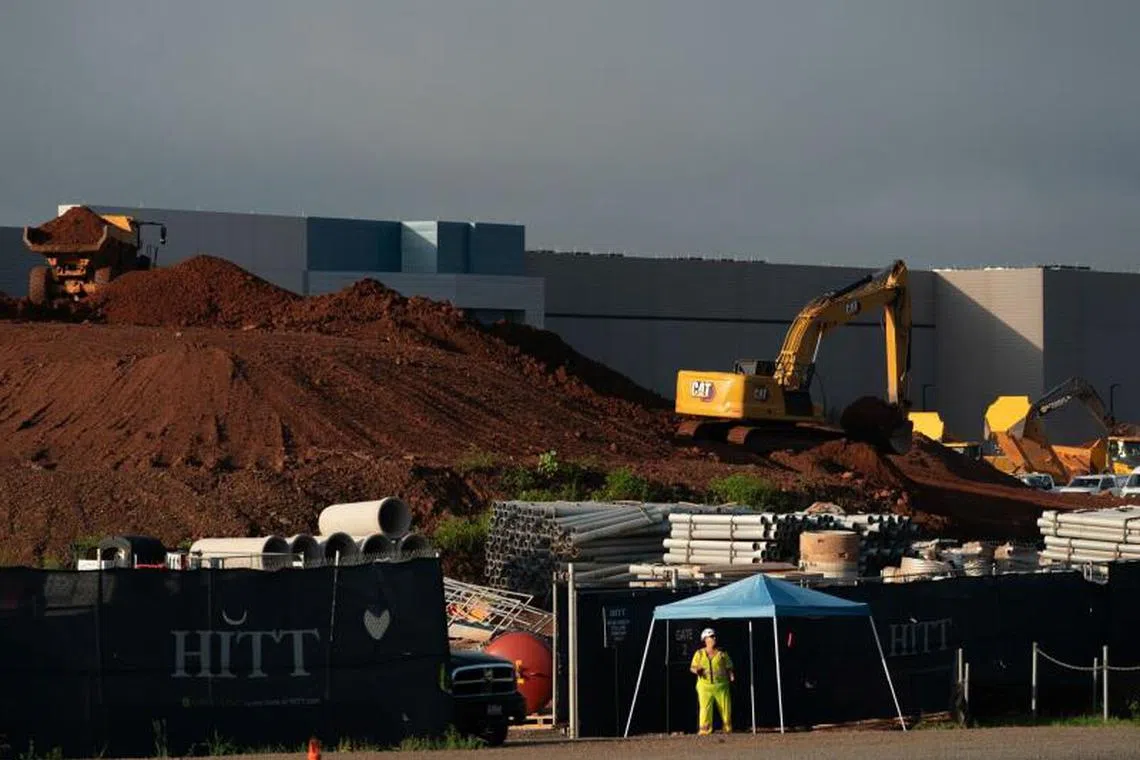 Construction crews work at the site of a planned Digital Realty data center in Manassas, Virginia, US, on Wednesday, July 9, 2025. Total power usage in the US is expected to climb 2.15% in 2026, spurred largely by a 5% spike from commercial users because of the expansion of data centers, according to a US Energy Department report released in June. Photographer: Nathan Howard/Bloomberg