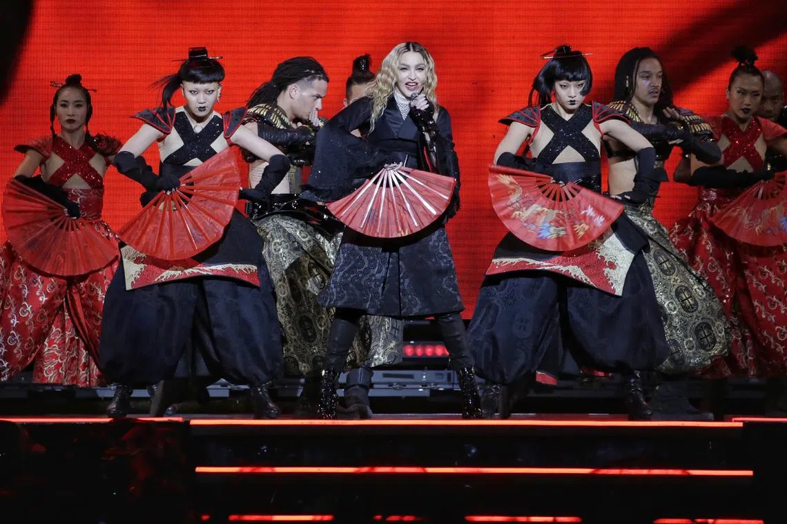 Madonna (centre) performing at Singapore's National Stadium in 2016.