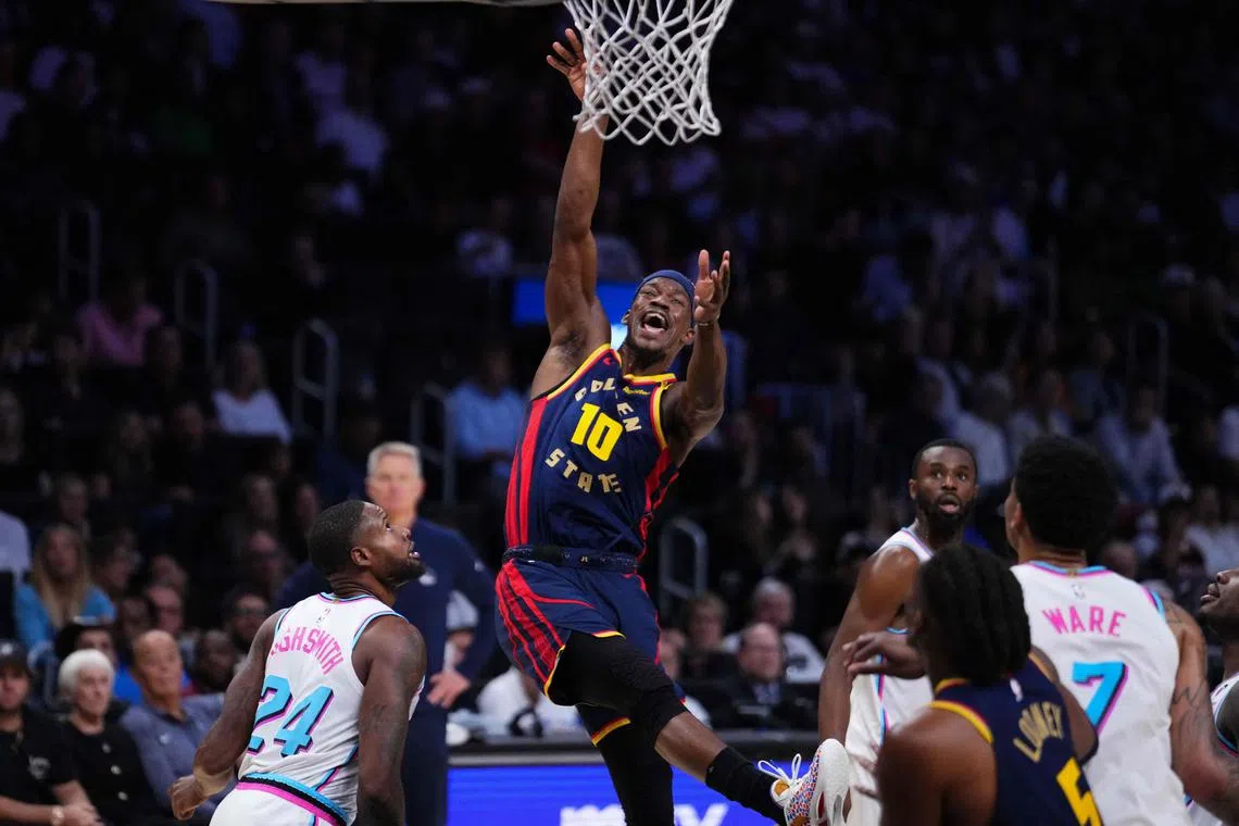 Jimmy Butler III of the Golden State Warriors reacts after getting fouled by Haywood Highsmith of the Miami Heat during the third quarter at Kaseya Centre.