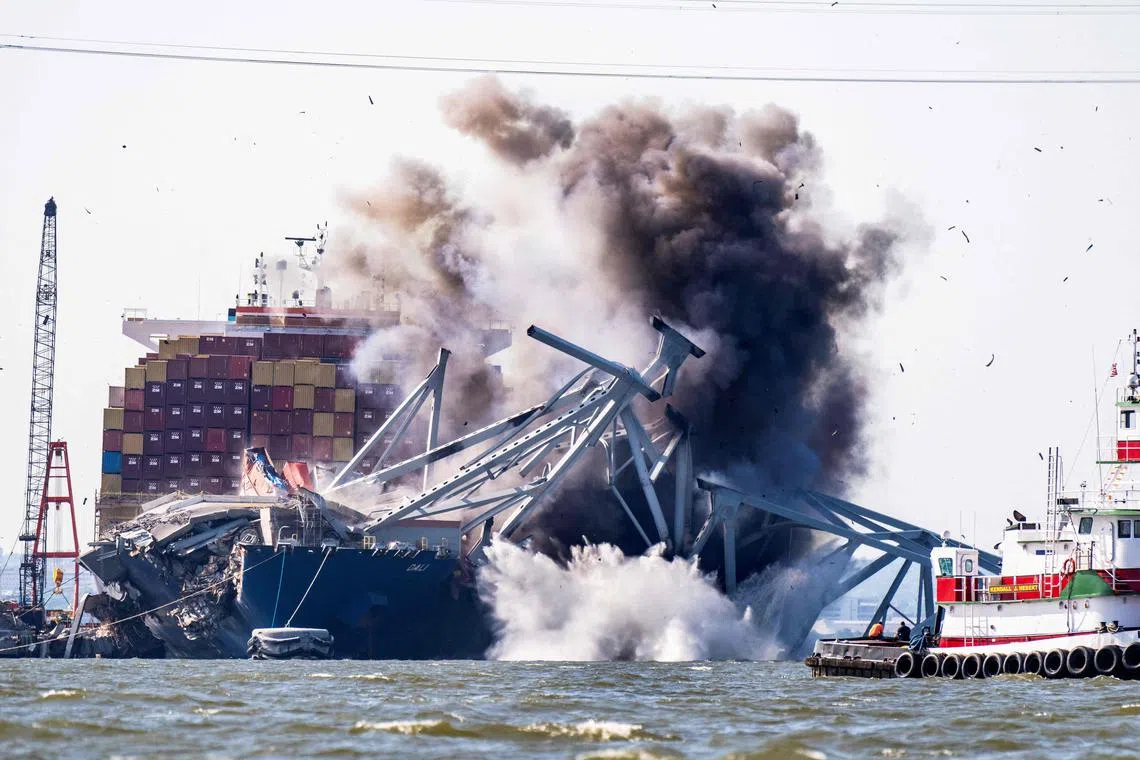A controlled demolition being conducted on a section of Baltimore's Francis Scott Key Bridge, resting on the MV Dali, in May 2024.