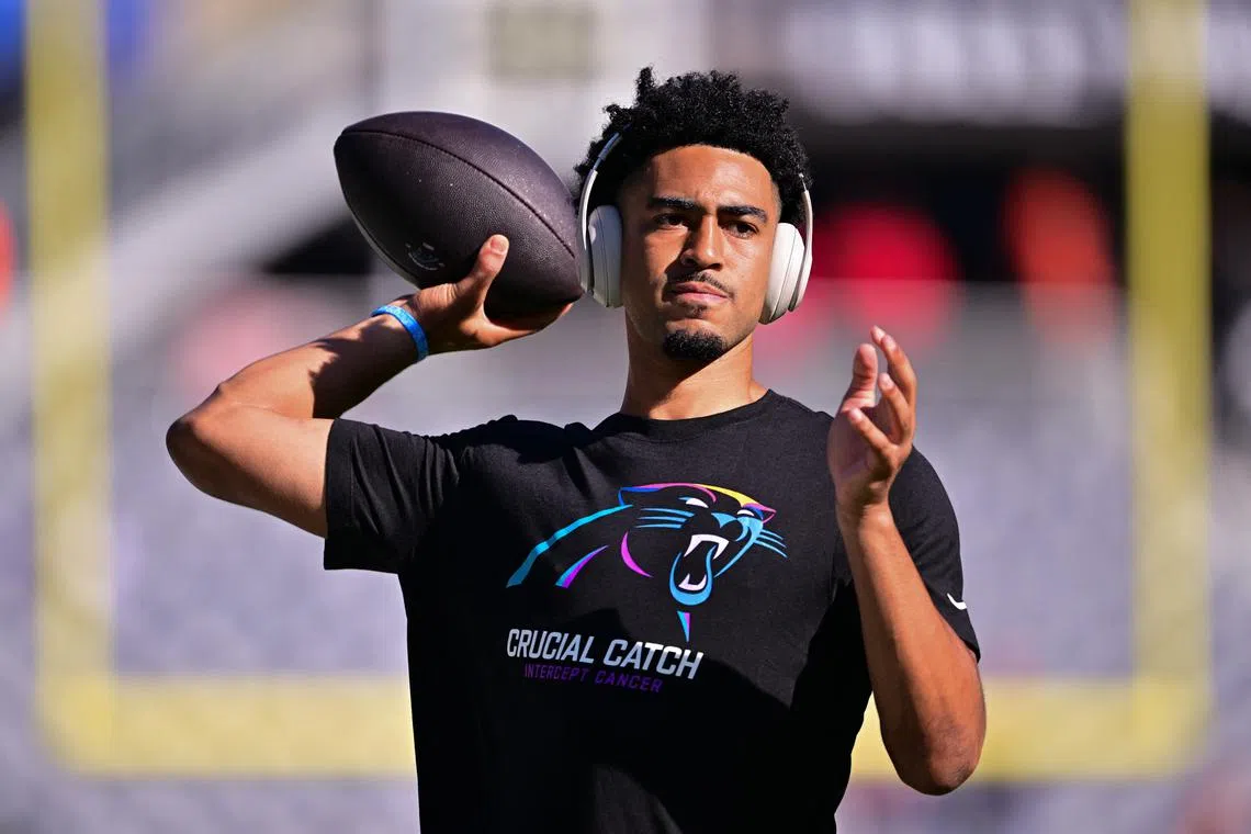 FILE PHOTO: Oct 6, 2024; Chicago, Illinois, USA; Carolina Panthers quarterback Bryce Young (9) warms up before the game against the Chicago Bears at Soldier Field. Mandatory Credit: Daniel Bartel-Imagn Images/File Photo