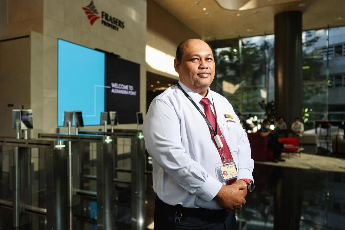 Razali Jais, a senior security officer at Alexandra Point, says that AI can help workers work faster, but officers remain essential for responding to incidents on the ground.