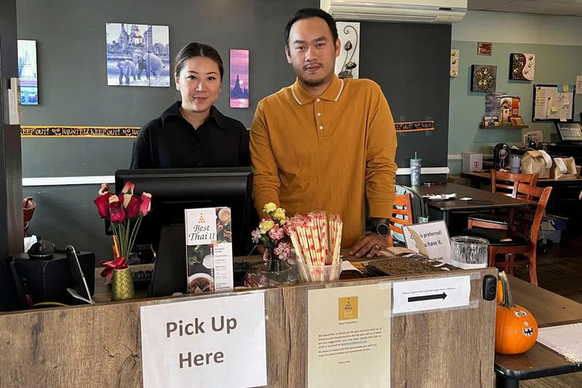 Pongsakorn Hanjitsuwan and his wife Samatchaya Limvathanalert, owners of Best Thai II restaurant, who opened in the hours after the Lewiston shooting and were one of the first local businesses serving customers during the nearby shelter-in-place order, pose in Bath, Maine, U.S., October 27, 2023. REUTERS/Gabriella Borter
