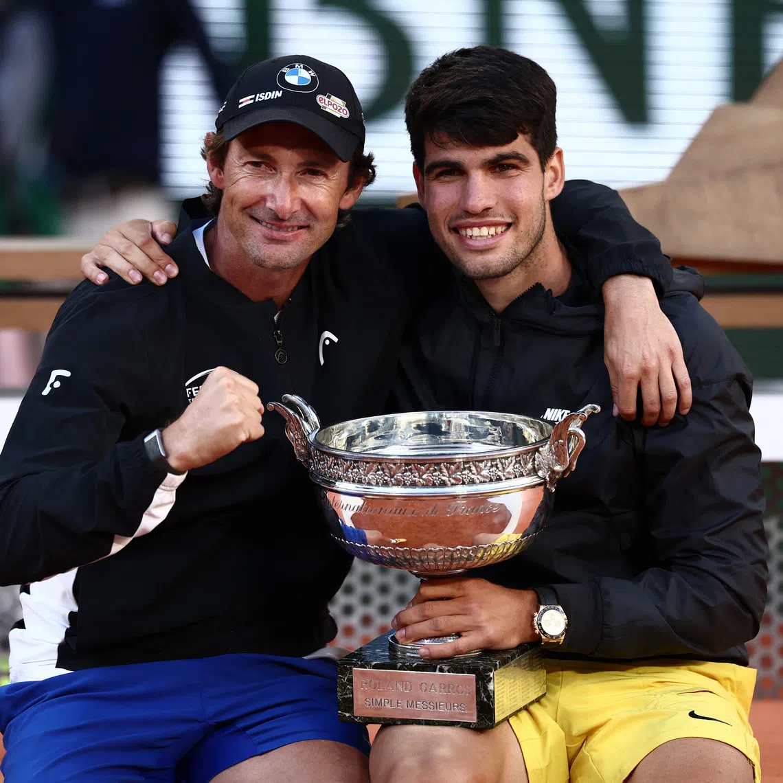 Tennis - French Open - Roland Garros, Paris, France - June 9, 2024 Spain's Carlos Alcaraz celebrates with coach Juan Carlos Ferrero after winning the men's singles final against Germany's Alexander Zverev REUTERS/Yves Herman