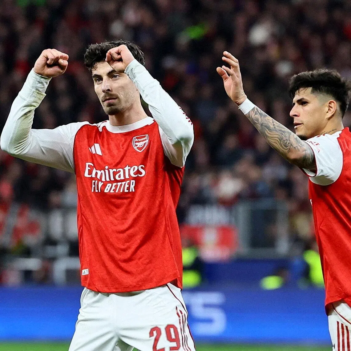 Soccer Football - UEFA Champions League - Round 16 - First Leg - Bayer Leverkusen v Arsenal - BayArena, Leverkusen, Germany - March 11, 2026
Arsenal's Kai Havertz celebrates scoring their first goal with Piero Hincapie REUTERS/Wolfgang Rattay     TPX IMAGES OF THE DAY     