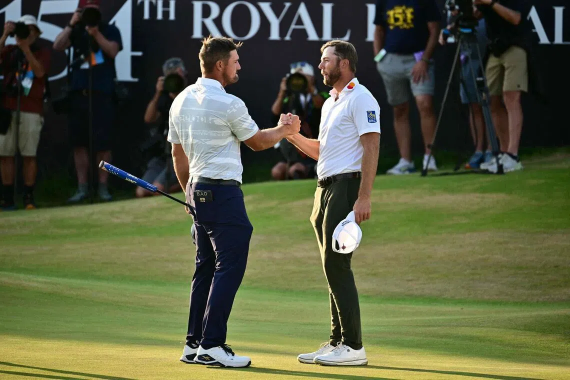 US golfers Bryson DeChambeau (left) and Sam Burns shaking hands on July 18 after their third rounds at the British Open.