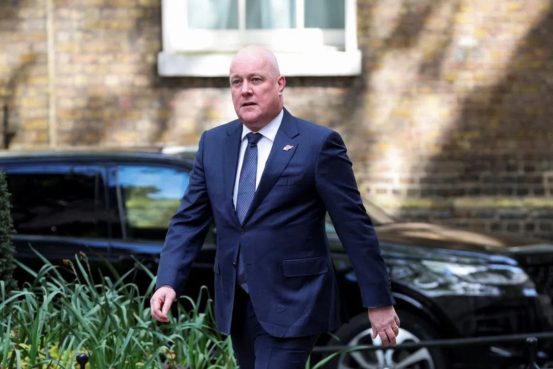 FILE PHOTO: New Zealand's Prime Minister Christopher Luxon walks at Downing Street to meet Britain's Prime Minister Keir Starmer, in London, Britain, April 22, 2025. REUTERS/Belinda Jiao/File Photo