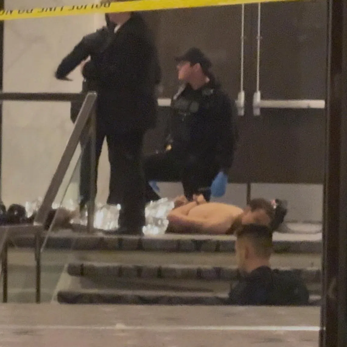 Cole Tomas Allen, a suspect in the shooting incident at the White House Correspondents' Association dinner, lies on the floor after being detained by law enforcement personnel, in Washington, D.C., U.S., April 25, 2026, in this screengrab from a video. Bill Frischling/ CQ Roll Call/Handout via REUTERS