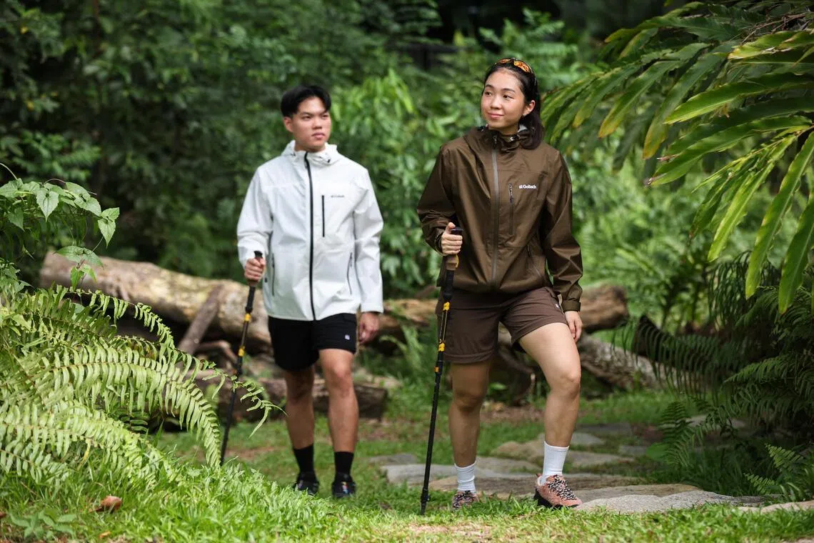 Kenneth Wong and Maribelle Su wearing the Trail Flex Convertible Pants and Stormshield Ultralight jacket.