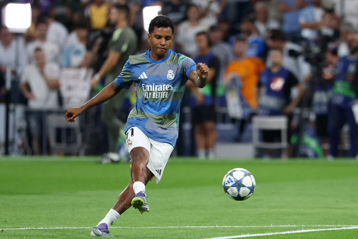 Soccer Football - UEFA Champions League - Real Madrid v Olympique de Marseille - Santiago Bernabeu, Madrid, Spain - September 16, 2025 Real Madrid's Rodrygo during the warm up before the match REUTERS/Juan Medina