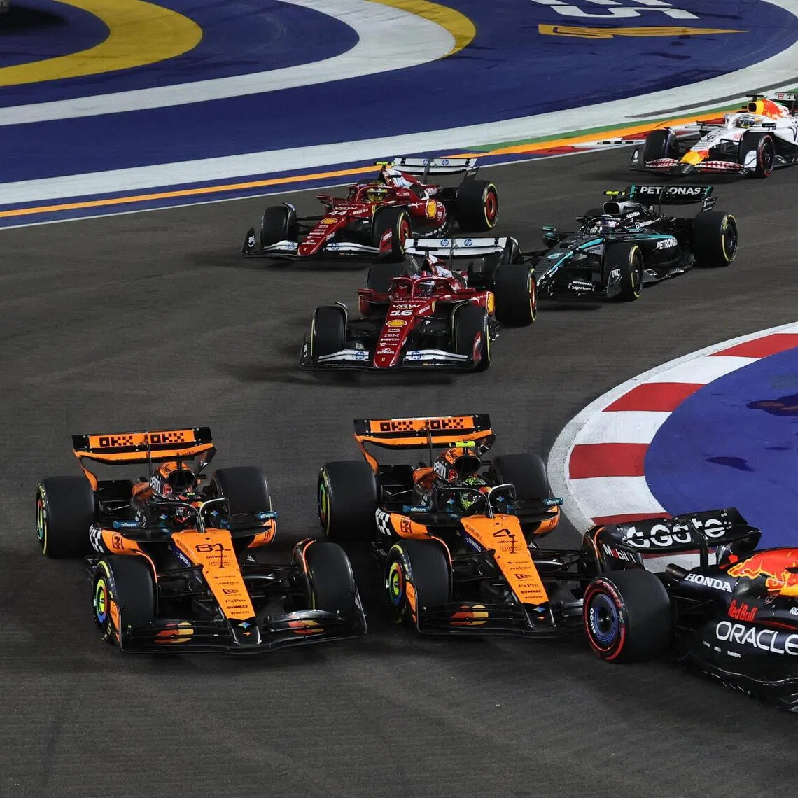 McLaren's Oscar Piastri and Lando Norris banged wheels at Turn 3 in the first lap of the Singapore Grand Prix on Oct 5.