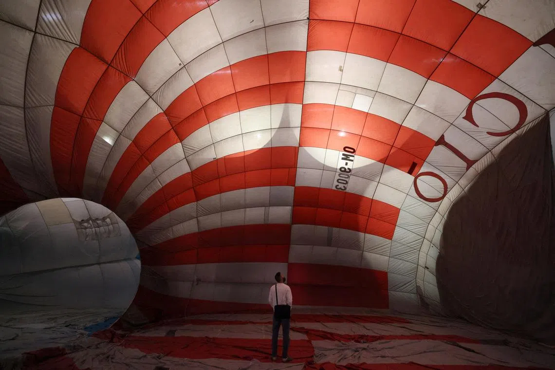 A man walks in designer Lousy Auber’s Keep Your Bubble immersive installation which explores the relationship between personal and collective space, as part of the Milan Design Week Fuorisalone exhibition, in Milan, Italy, April 21.