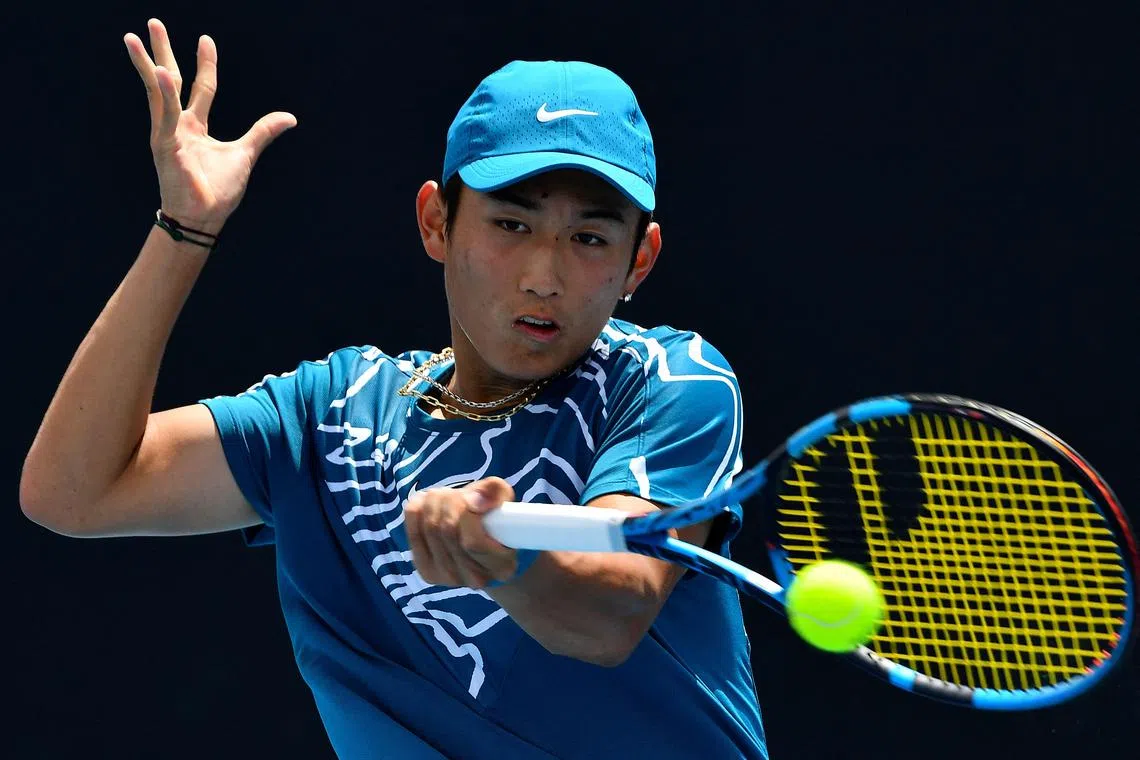 China's Shang Juncheng hits a return against Germany's Oscar Otte during their match at the Australian Open on Monday. 