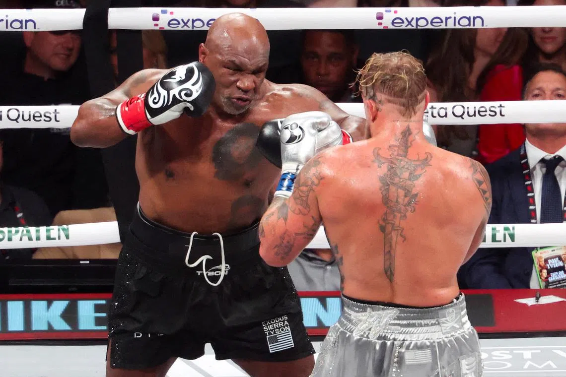 FILE PHOTO: Nov 15, 2024; Arlington, Texas, UNITED STATES;  Mike Tyson (black gloves) fights Jake Paul (silver gloves) at AT&T Stadium. Mandatory Credit: Kevin Jairaj-Imagn Images/File Photo