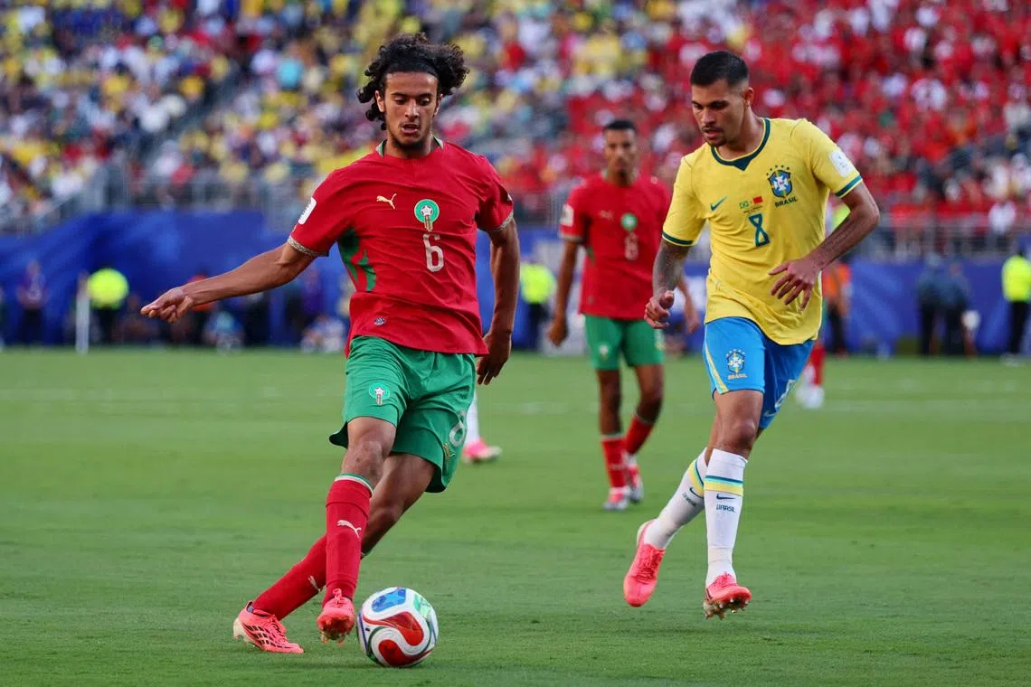 Soccer Football - FIFA World Cup 2026 - Group C - Brazil v Morocco - New York/New Jersey Stadium, East Rutherford, New Jersey, U.S. - June 13, 2026 Morocco's Ayyoub Bouaddi in action with Brazil's Bruno Guimaraes IMAGN IMAGES via Reuters/Caean Couto