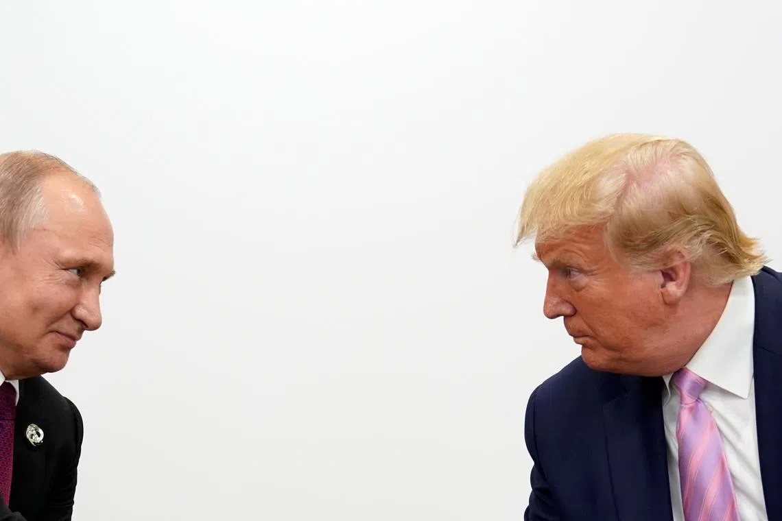 U.S. President Donald Trump and Russian President Vladimir Putin hold a bilateral meeting at the G20 leaders summit in Osaka, Japan June 28, 2019.  REUTERS/Kevin Lamarque/File Photo