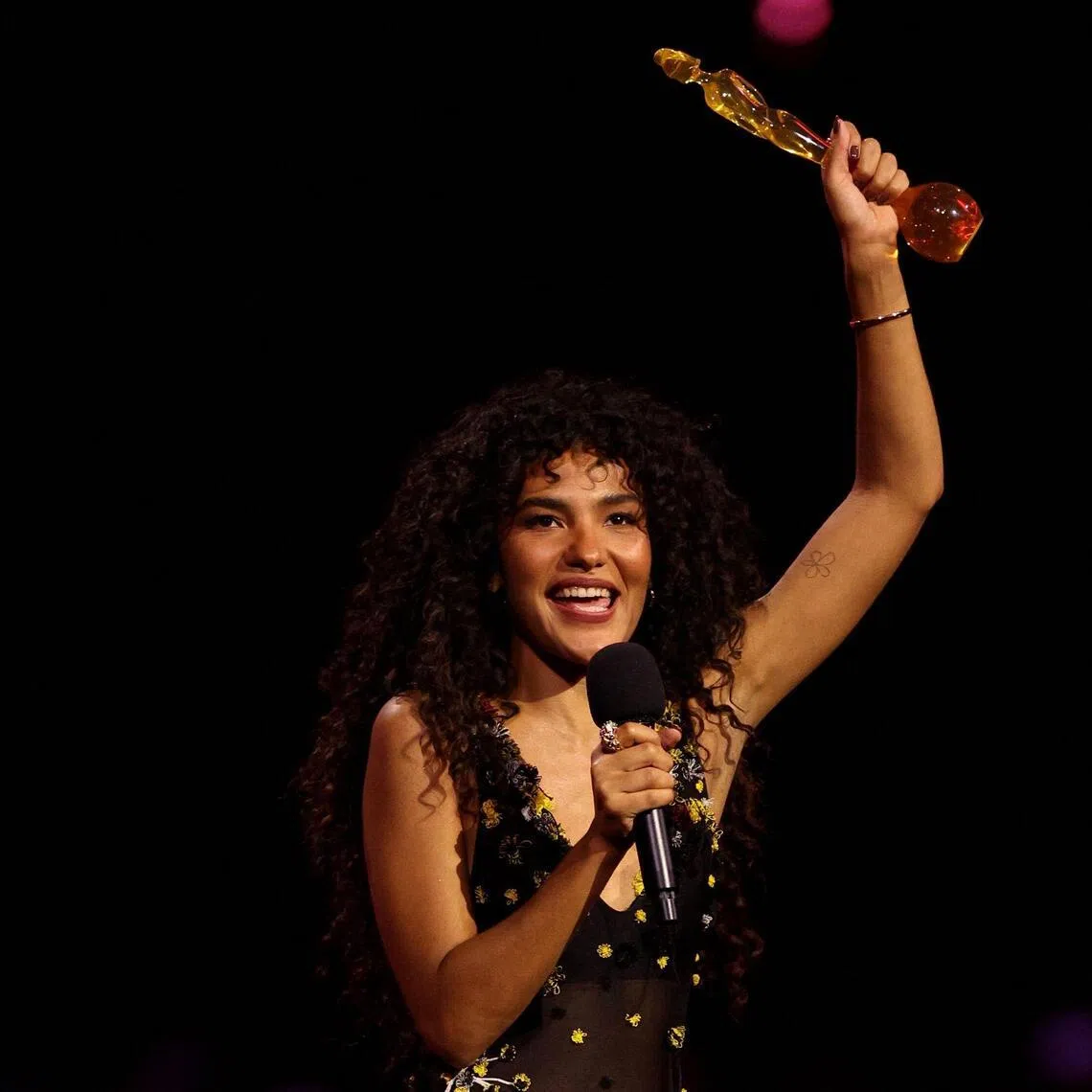 British singer Olivia Dean speaks on stage after receiving the award for best Pop act during the Brit Awards 2026 at the Co-op Live arena, in Manchester on Feb 28.