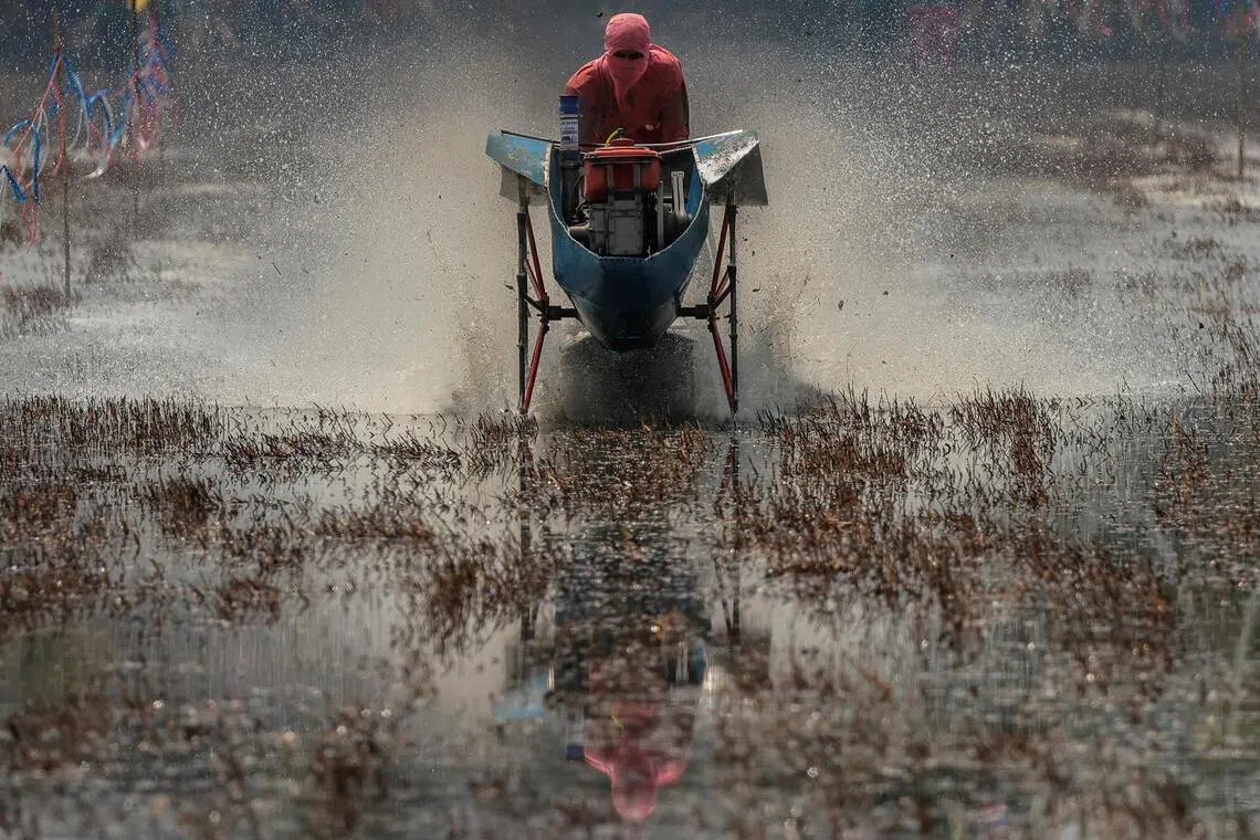 A man rides a modified farming tractor as he competes in an annual tractor race marking the start of the rice farming season in Ayutthaya province, Thailand, May 10, 2026. REUTERS/Chalinee Thirasupa     TPX IMAGES OF THE DAY     