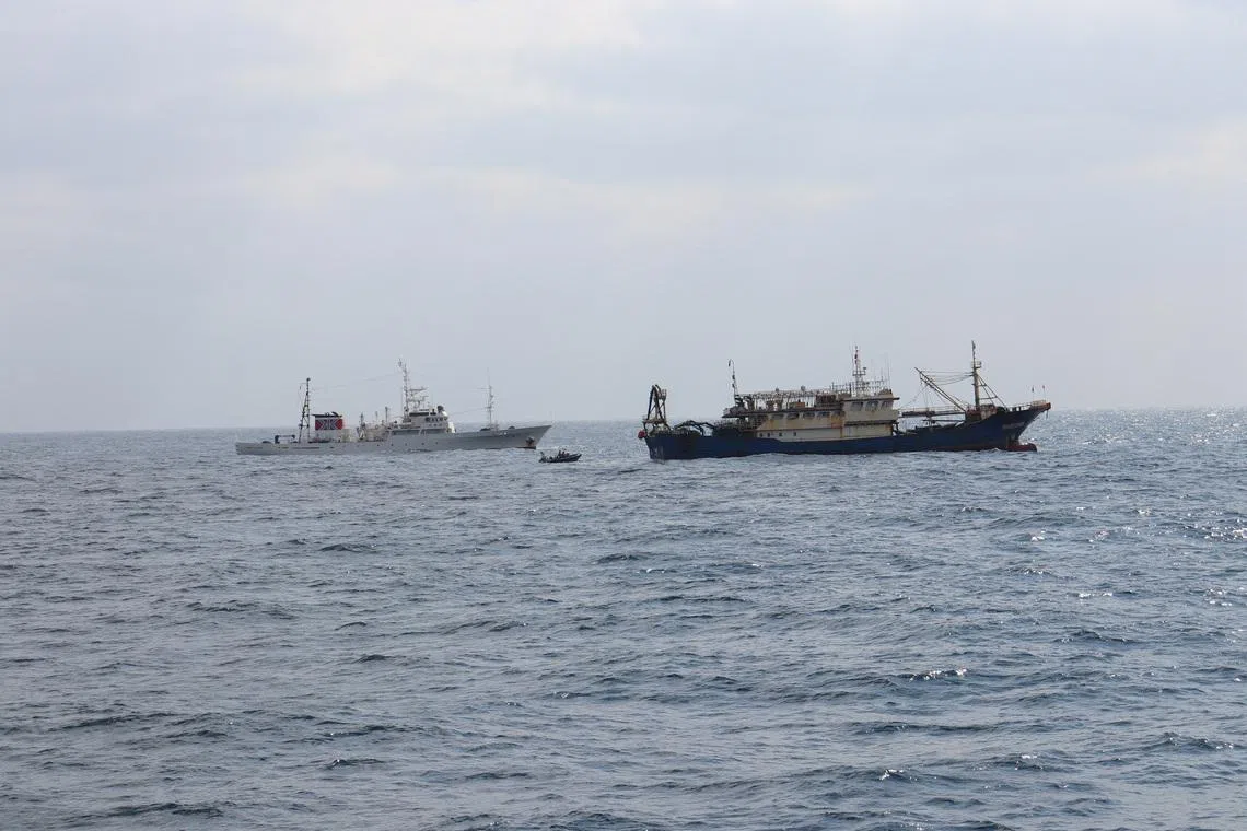 Japan's Fisheries Agency patrol vessel \"Hakuo Maru\" and Chinese fishing vessel \"Qiong Dong Yu 11998\" in waters off southwest Nagasaki Prefecture, Japan, February 12, 2026, in this handout photo provided by the Fisheries Agency of Japan. Fisheries Agency of Japan/Handout via REUTERS