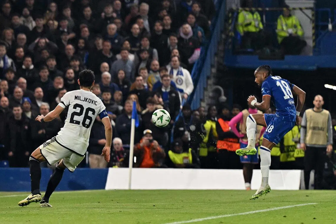 Chelsea's French striker Christopher Nkunku (right) scoring the team's seventh goal.