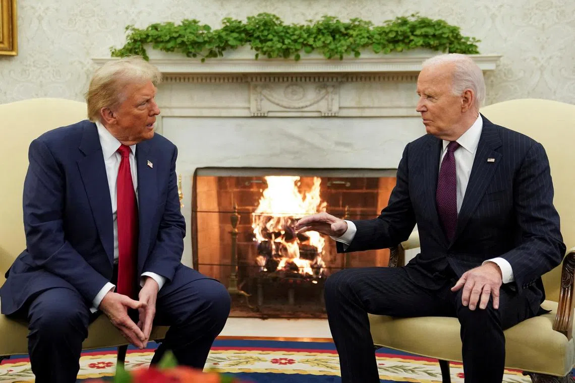 FILE PHOTO: U.S. President Joe Biden meets with President-elect Donald Trump in the Oval Office at the White House in Washington, U.S., November 13, 2024. REUTERS/Kevin Lamarque/File Photo