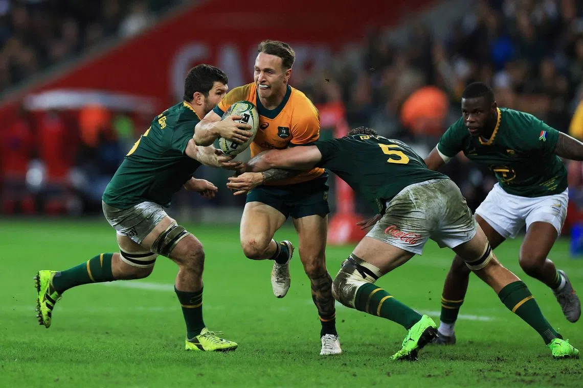 FILE PHOTO: Rugby Union - Rugby Championship - South Africa v Australia - DHL Stadium, Cape Town, South Africa - August 23, 2025  Australia's Corey Toole in action with South Africa's Ruan Nortje REUTERS/Esa Alexander/File Photo
