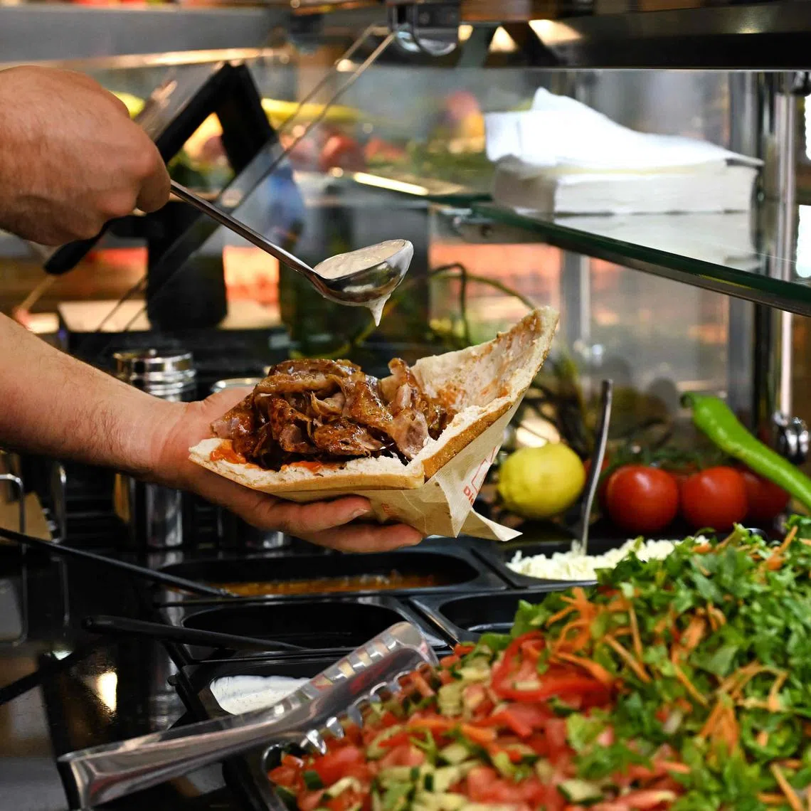 The doner, made with thinly sliced meat cooked on a vertical rotisserie, has its origins in Turkey but is also beloved in Germany after being introduced there by Turkish migrants.