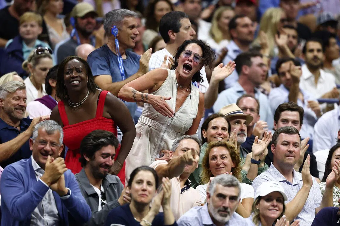 Fans cheer during the US Open men's semi-final match between Felix Auger-Aliassime of Canada and Jannik Sinner of Italy.