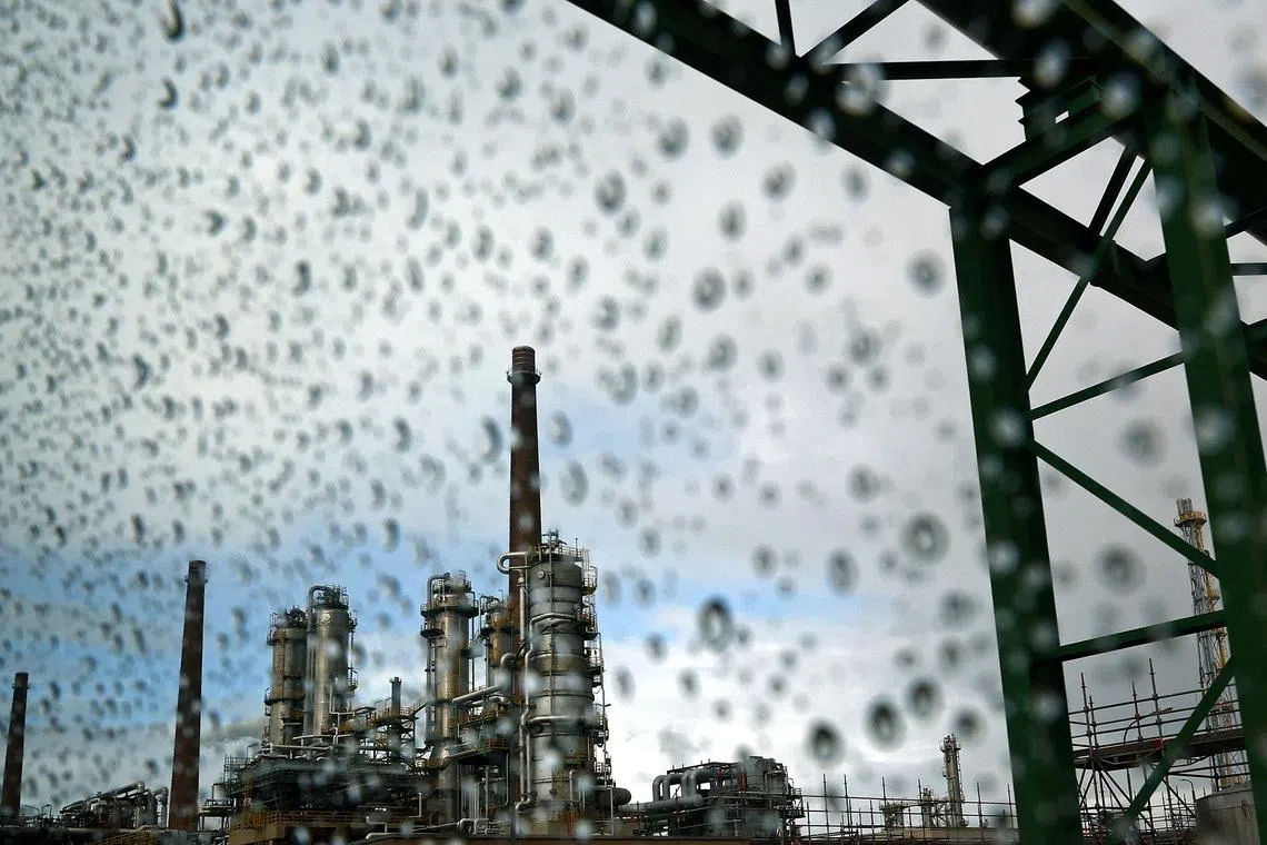 FILE PHOTO: A general view of the PCK refinery, a crude oil processing facility supplying gasoline, jet fuel, diesel and fuel oil, is seen through a rain‑spattered window in Schwedt/Oder, Germany, March 31, 2026. REUTERS/Lisi Niesner/File Photo