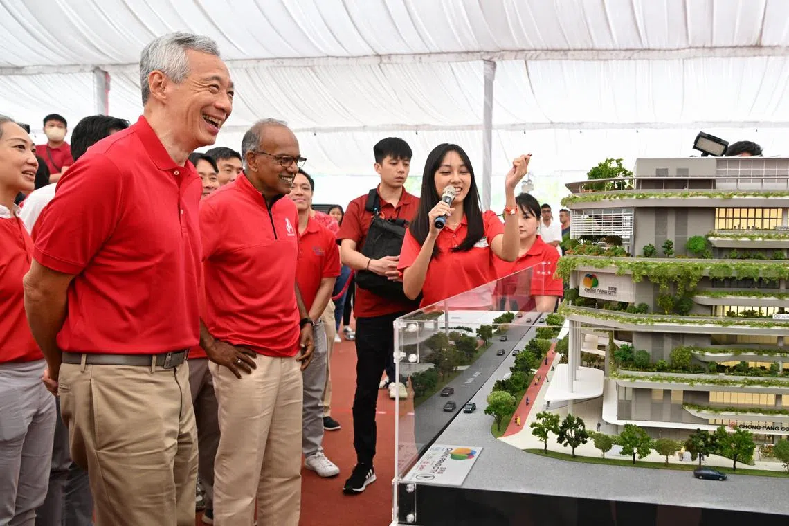 PM Lee Hsien Loong, accompanied by K. Shanmugam, Minister for Law, looking at the architecture model after the groundbreaking ceremony of Chong Pang City on March 26, 2023.