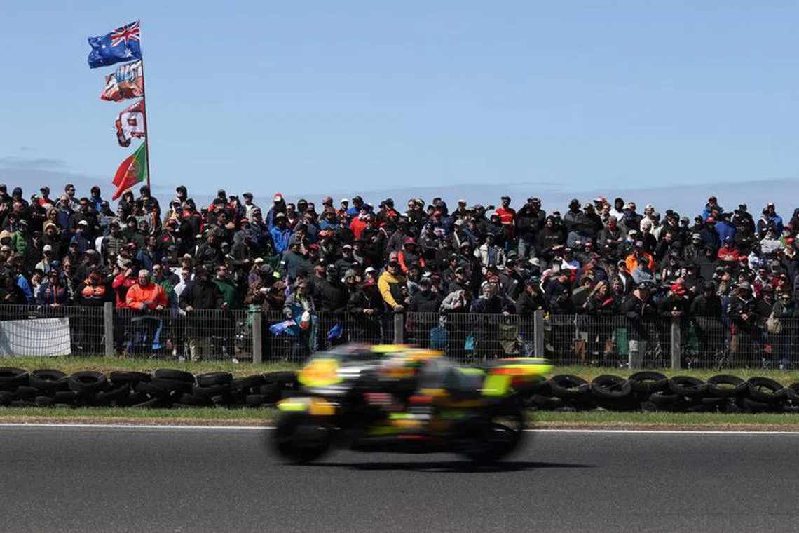 FILE PHOTO: MotoGP - Australian Grand Prix - Phillip Island Grand Prix Circuit, Phillip Island, Australia - October 16, 2022 Fans watch the action during the MotoGP race REUTERS/Loren Elliott/File Photo