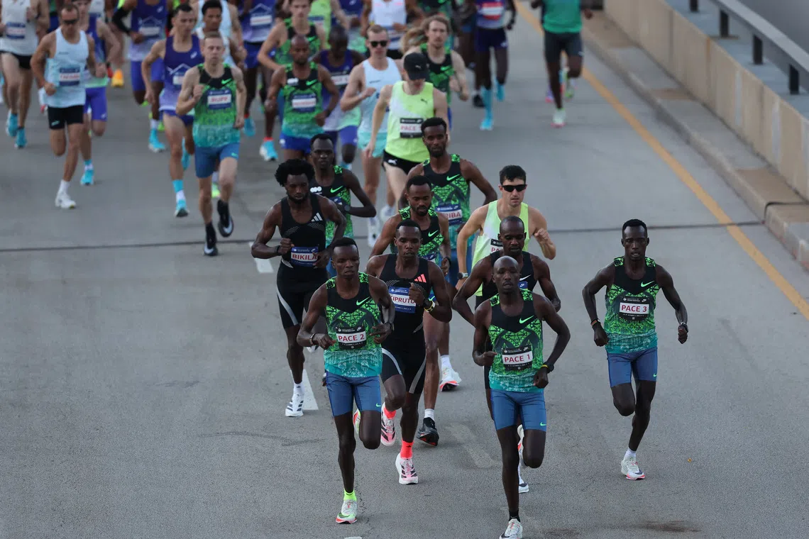 Oct 11, 2026; Chicago, IL, USA; Jacob Kiplimo of Uganda and Amos Kipruto of Kenya lead the 2026 Chicago Marathon in Grant Park. Mandatory Credit: Talia Sprague-Imagn Images