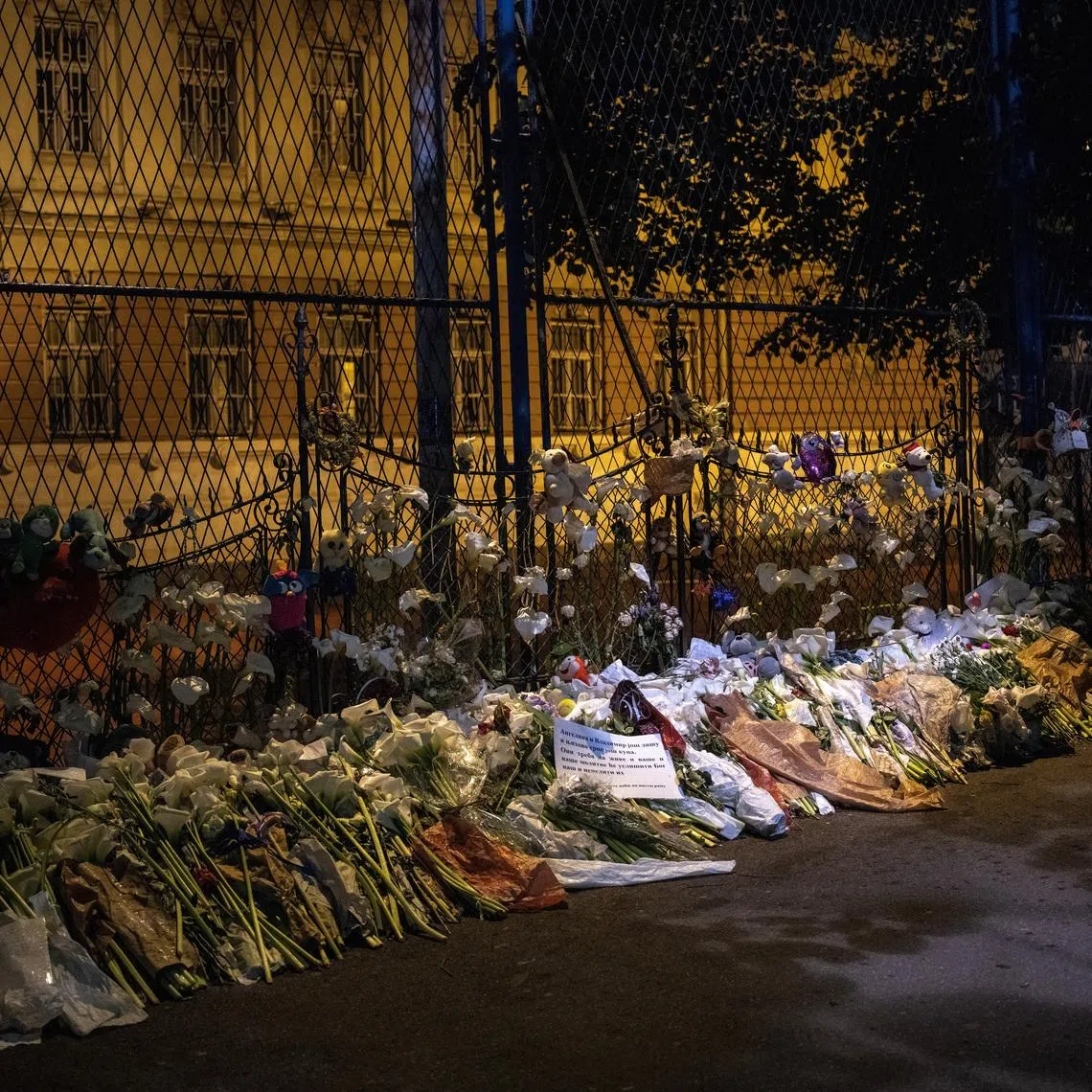 Flowers are laid to pay tribute to victims of the mass shooting at Vladislav Ribnikar school in Belgrade, Serbia, May 11, 2023. REUTERS/Marko Djurica